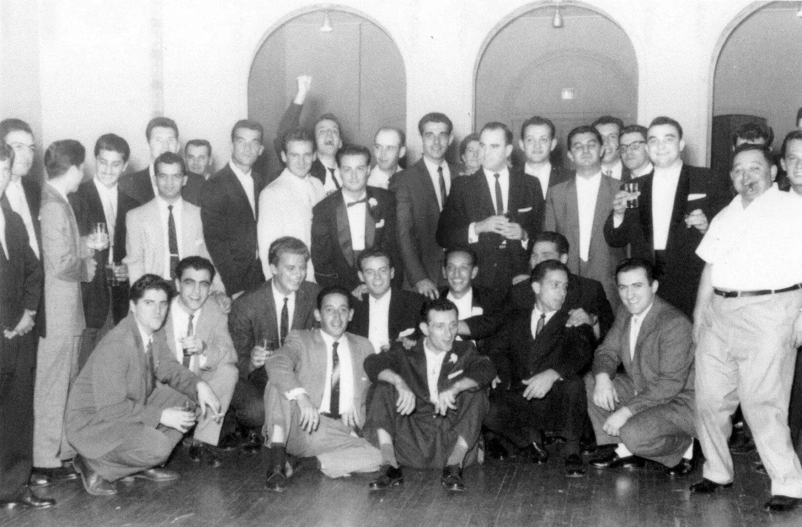 A group of men in suits and ties posing for the camera.