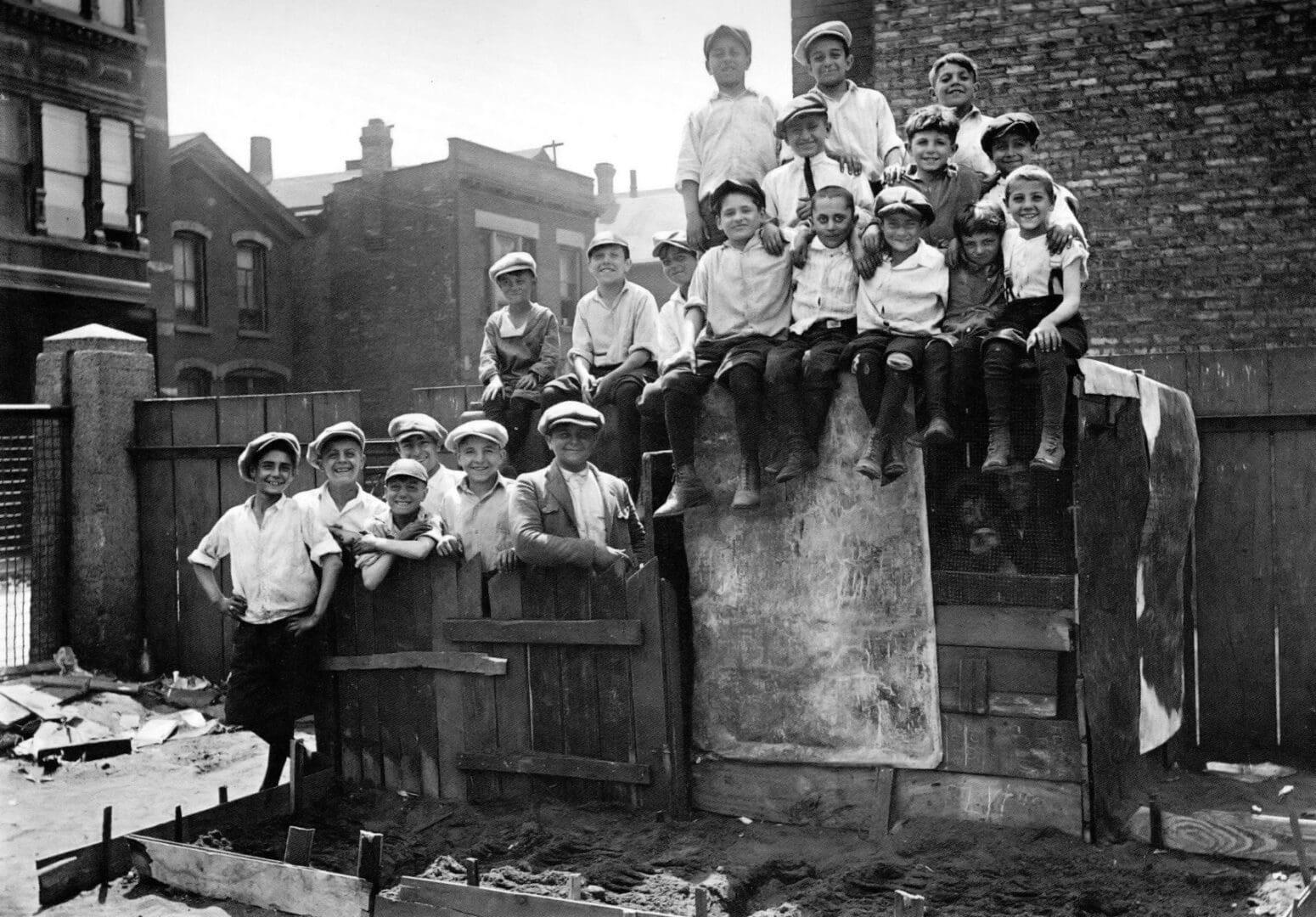A group of children sitting on top of steps.